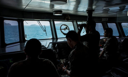 Anggota awak kapal keamanan Kementerian Kelautan dan Perikanan mempersiapkan patroli di sepanjang zona ekonomi eksklusif Indonesia di Kepulauan Natuna